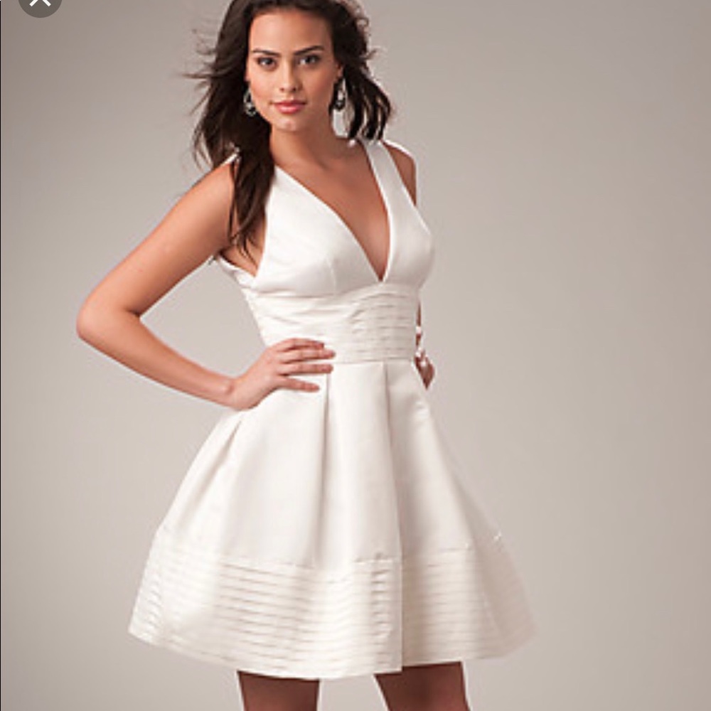Ships free!  Ivory v neck/back Box Pleated Dress